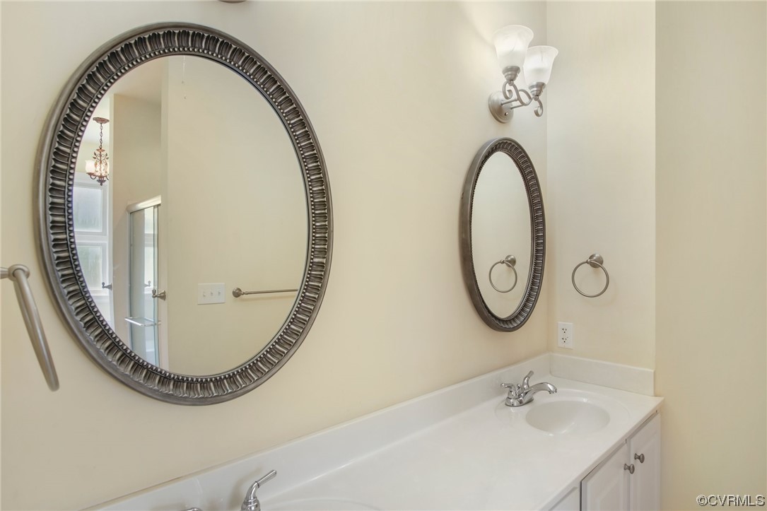 740 Marsh Pungo Road, Unit 8 Locust Hill, VA 23092 - Photo 28 of 50 a bathroom with a sink and a mirror