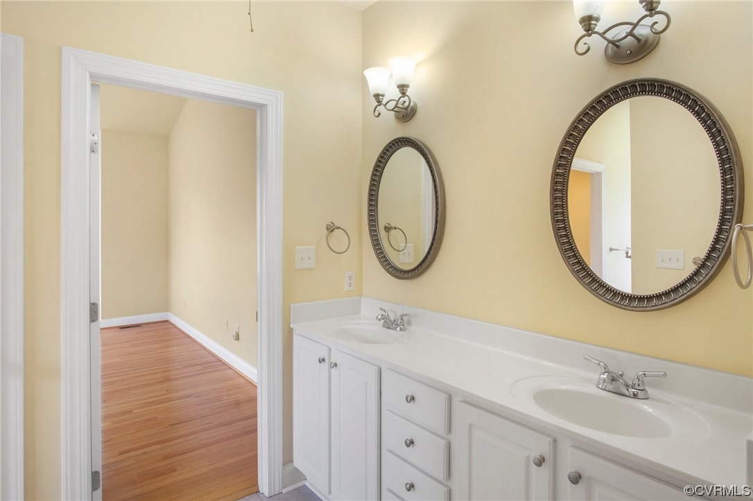 740 Marsh Pungo Road, Unit 8 Locust Hill, VA 23092 - Photo 29 of 50 a bathroom with a sink and a mirror