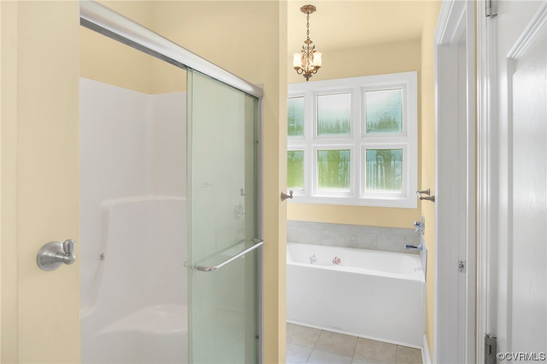740 Marsh Pungo Road, Unit 8 Locust Hill, VA 23092 - Photo 31 of 50 a bathroom with a bathtub and a shower