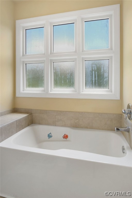 740 Marsh Pungo Road, Unit 8 Locust Hill, VA 23092 - Photo 32 of 50 a white bath tub sitting next to a window
