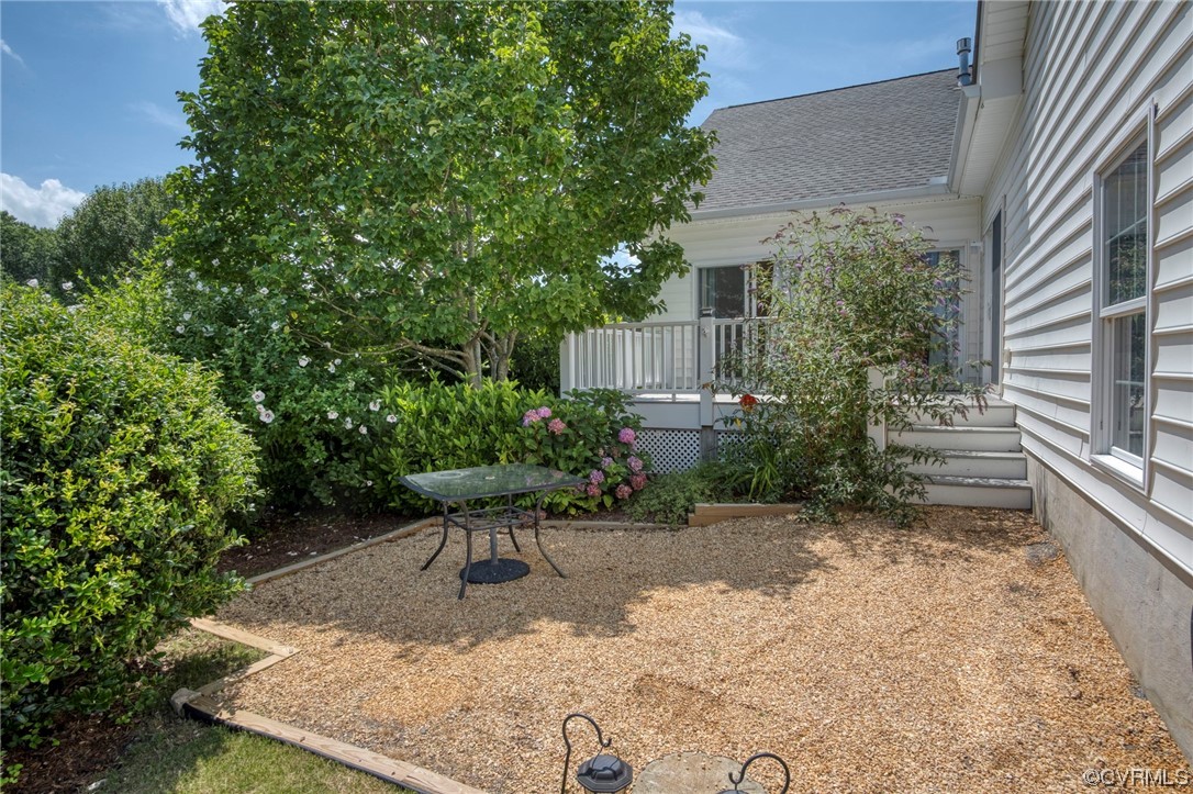 740 Marsh Pungo Road, Unit 8 Locust Hill, VA 23092 - Photo 37 of 50 a view of backyard with plants and outdoor seating