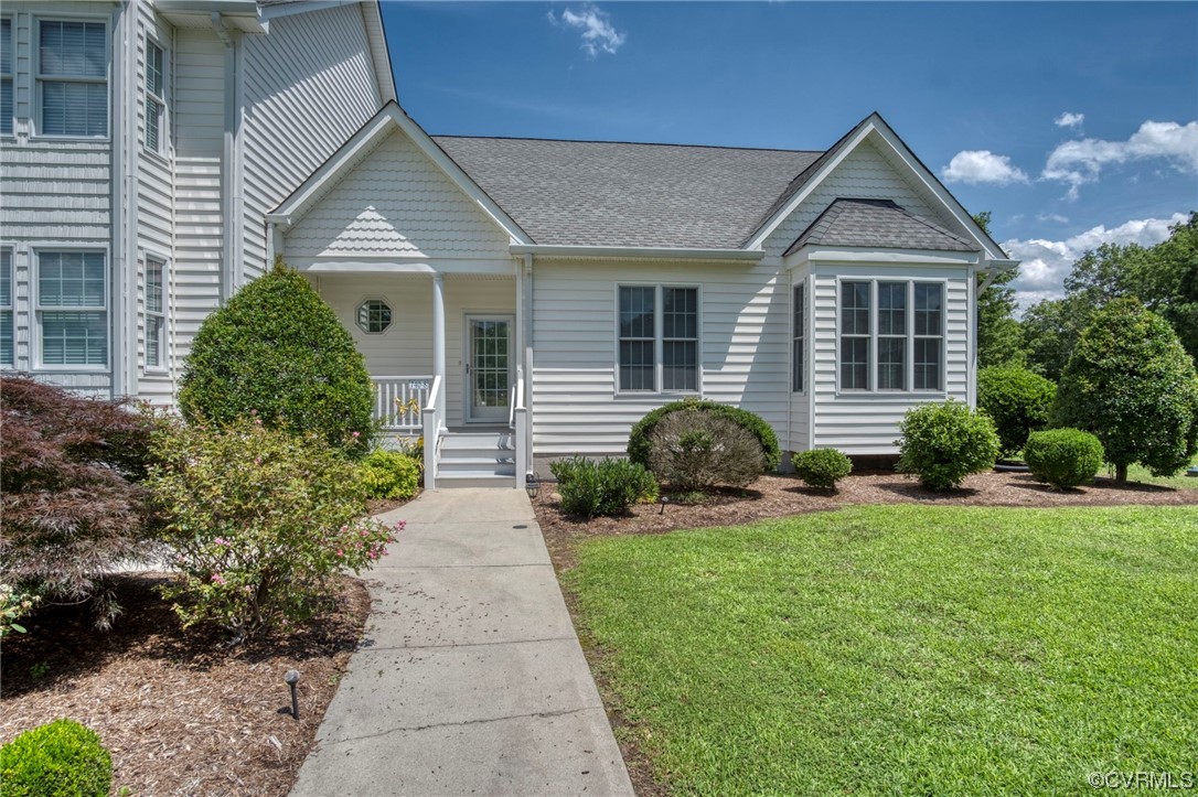 740 Marsh Pungo Road, Unit 8 Locust Hill, VA 23092 - Photo 4 of 50 a front view of a house with garden