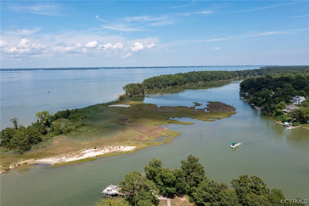 740 Marsh Pungo Road, Unit 8 Locust Hill, VA 23092 - Photo 43 of 50 a view of a lake with a yard
