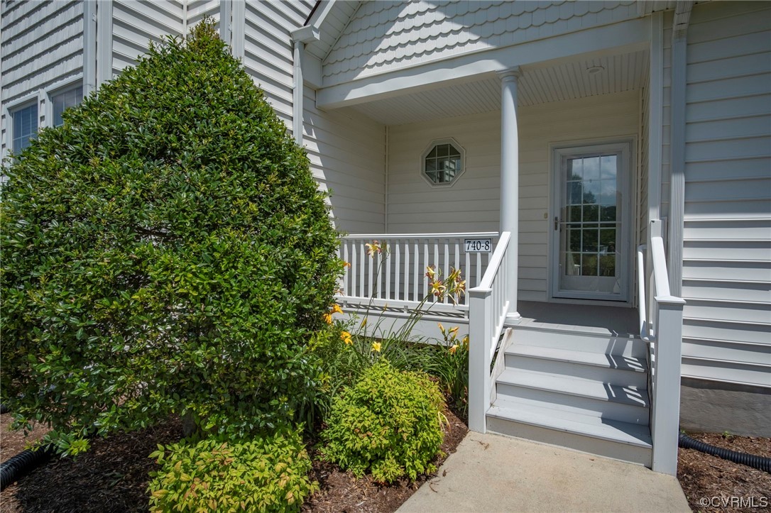740 Marsh Pungo Road, Unit 8 Locust Hill, VA 23092 - Photo 5 of 50 a view of a house with a yard