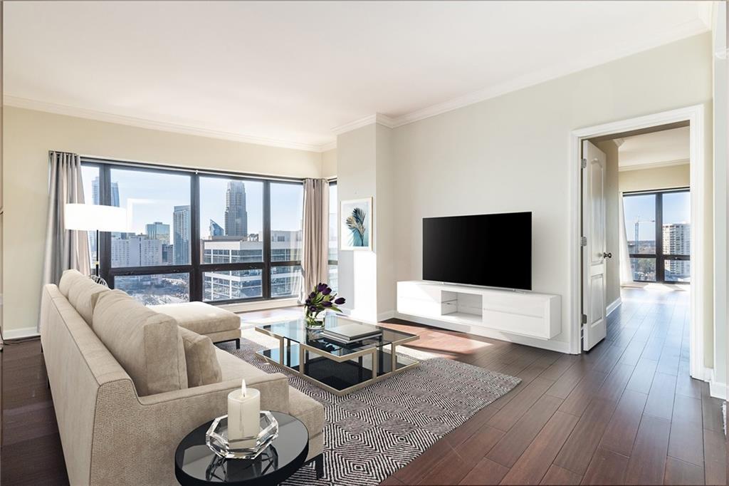 a living room with furniture and a flat screen tv