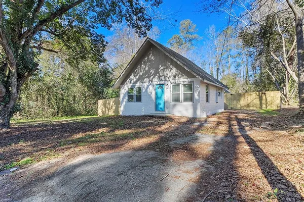 a view of house with yard