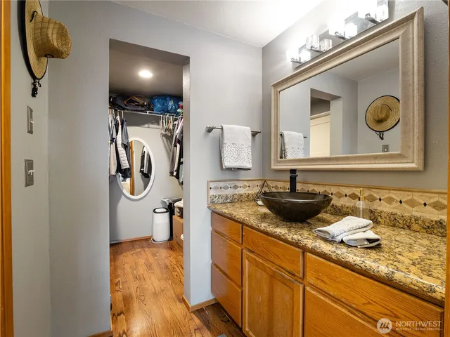 a white toilet sitting next to a shower curtain