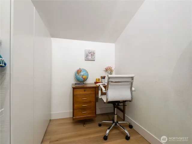 a bed room with a bed and a television