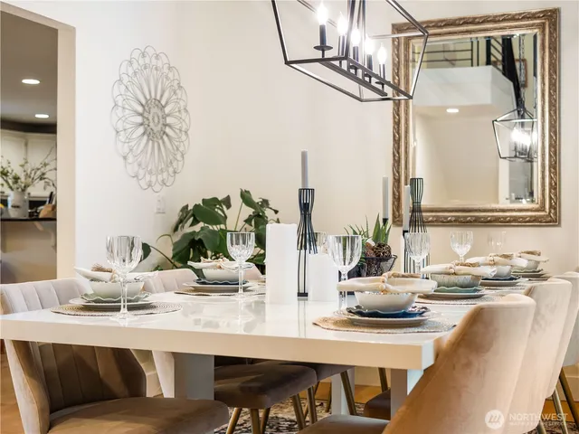 a dining room with a table and chairs