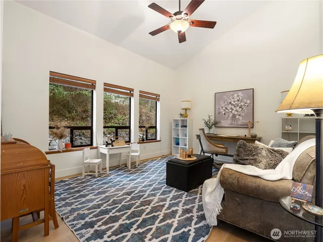 a living room with furniture and a large window