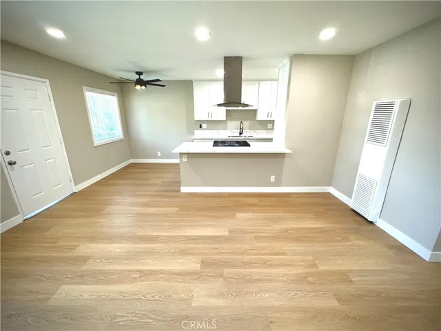 a view of a kitchen with a sink