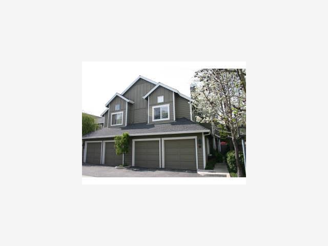 a black white house with a large window and large windows