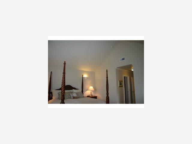 600 Willow Road, Unit 11 Menlo Park, CA 94025 - Photo 9 of 9 a hallway with a large mirror and a dresser