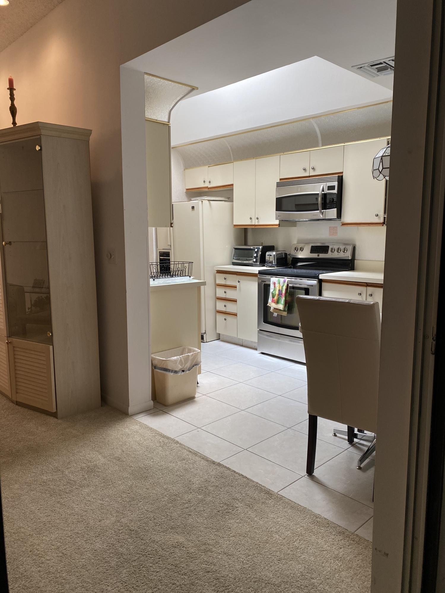 7472 La Paz Boulevard, Unit 308 Boca Raton, FL 33433 - Photo 14 of 22 Kitchen view from living room
