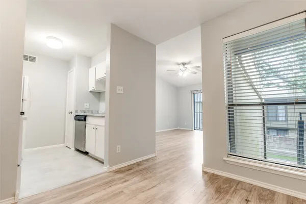 a view of a kitchen with a sink and a window