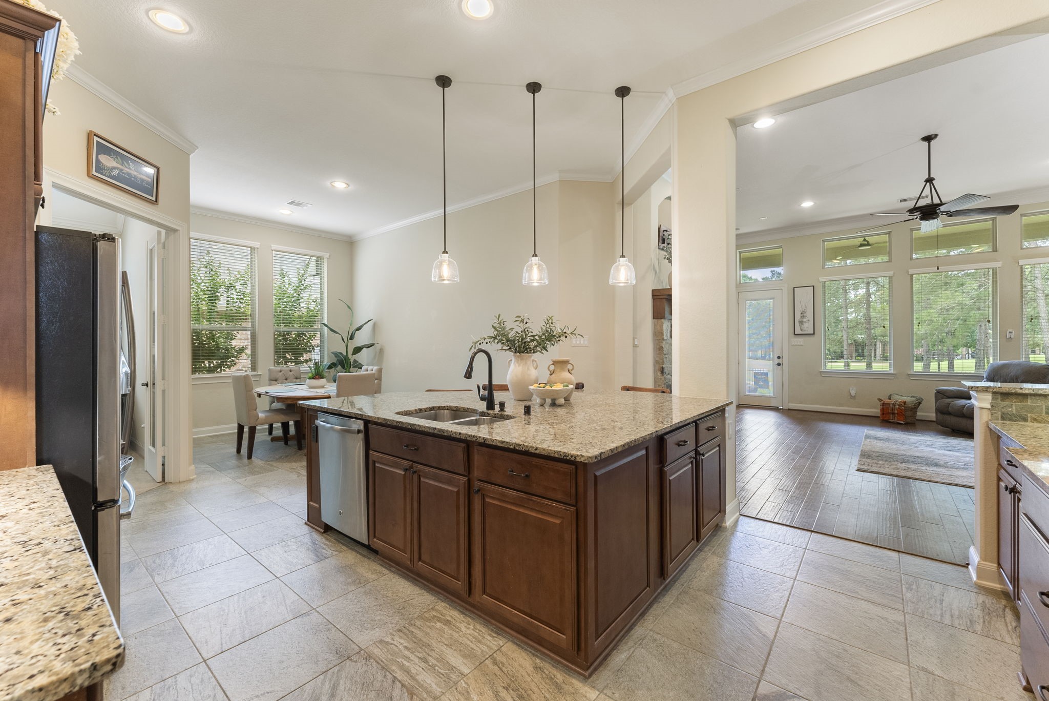 4787 Jackson Square Drive Conroe, TX 77304 - Photo 11 of 35 The open-concept design flows seamlessly into the family room, making this space the ultimate hub for entertaining and everyday living. With gleaming countertops, ample storage, and modern finishes, this kitchen isn’t just a place to cook—it’s where memories are made, stories are shared, and life happens.
