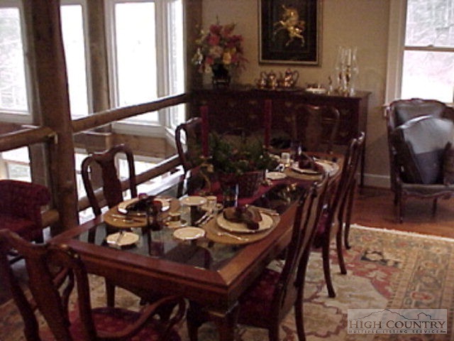 775 Meadow Road Ferguson, NC 28624 - Photo 17 of 20 a view of a dining room with furniture and chandelier