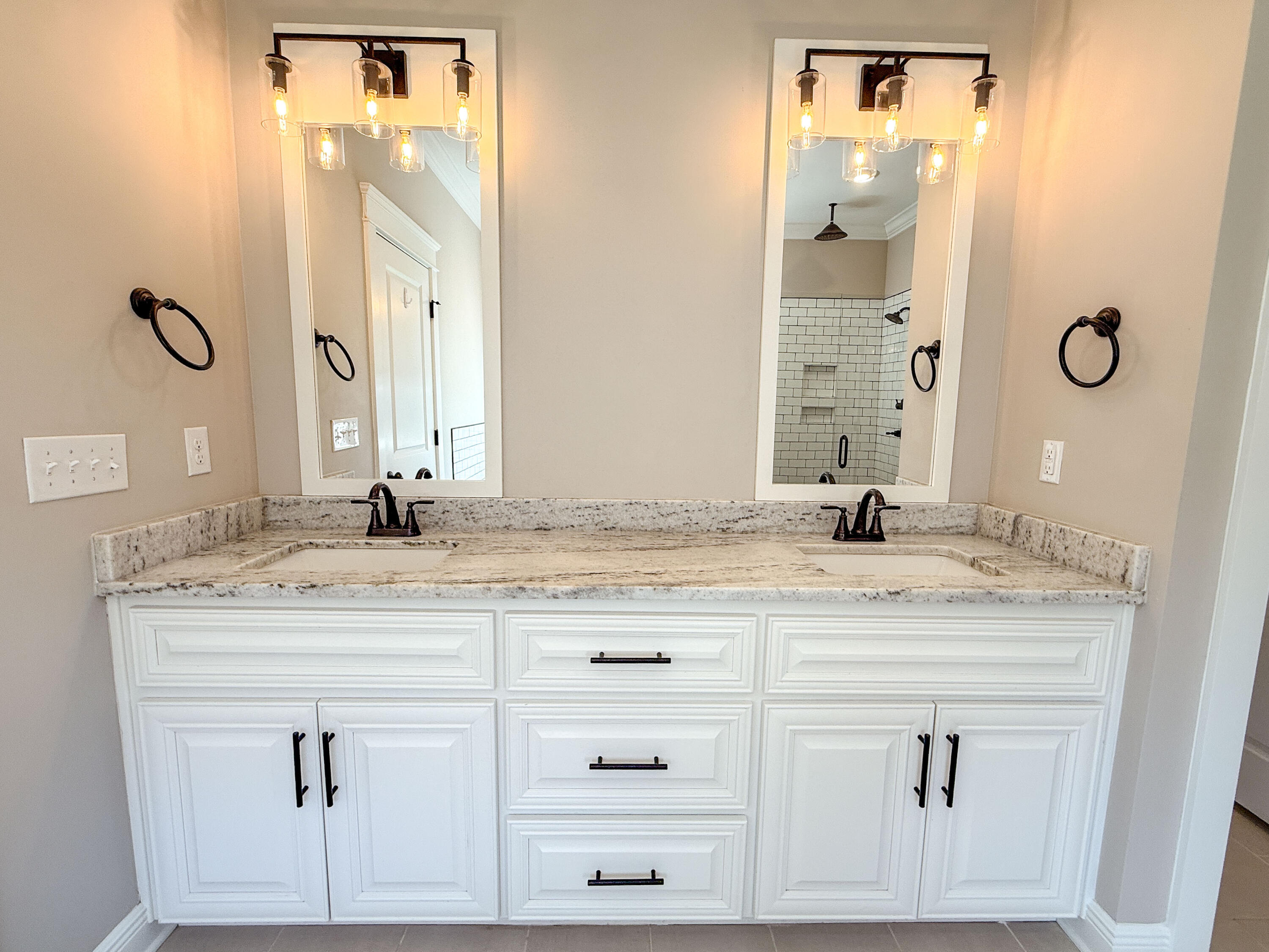 79 Mill Pond Cove Freeport, FL 32439 - Photo 14 of 63 a bathroom with a granite countertop sink vanity and mirror