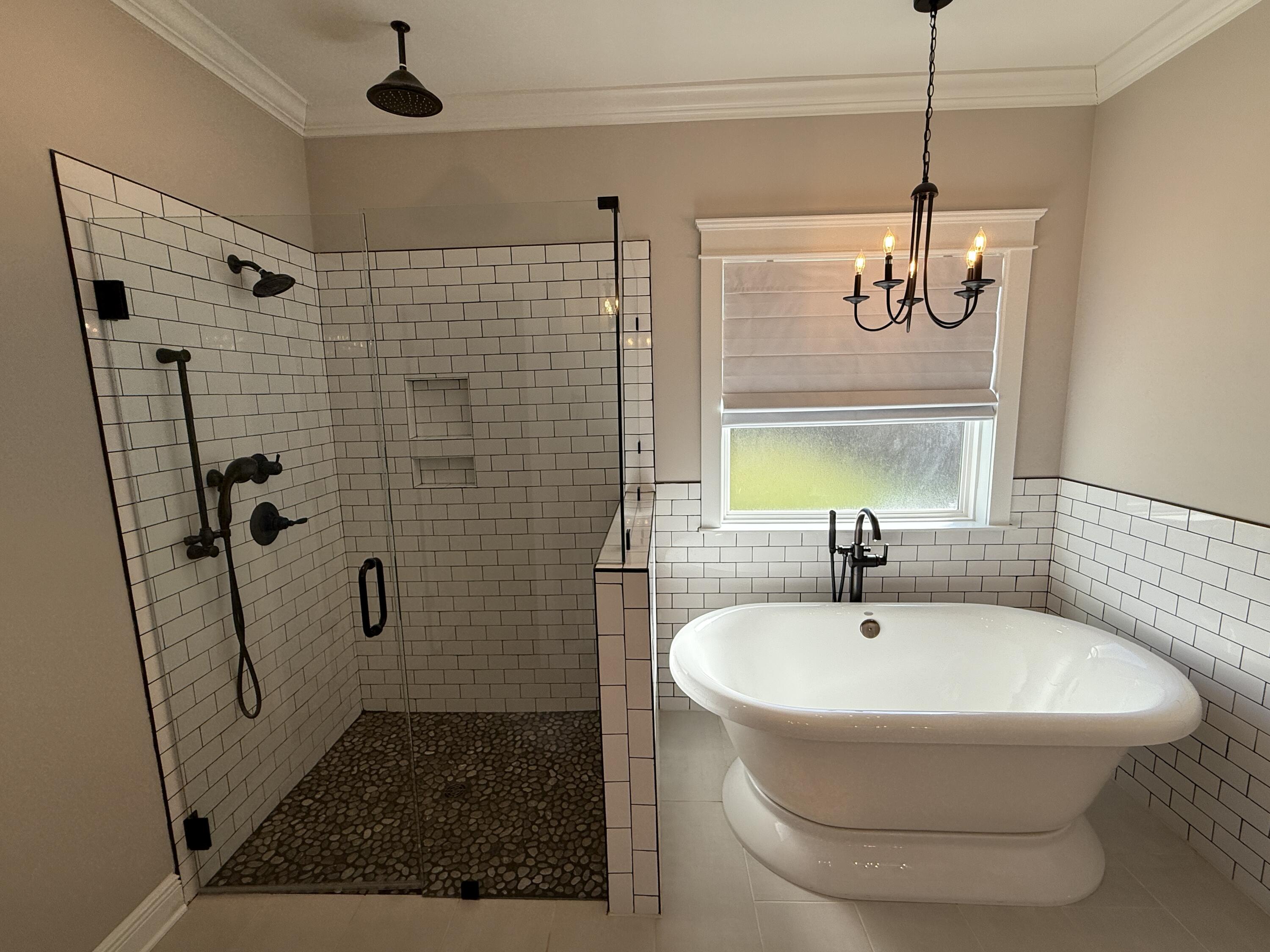 79 Mill Pond Cove Freeport, FL 32439 - Photo 17 of 63 a bathroom with a sink a window and shower