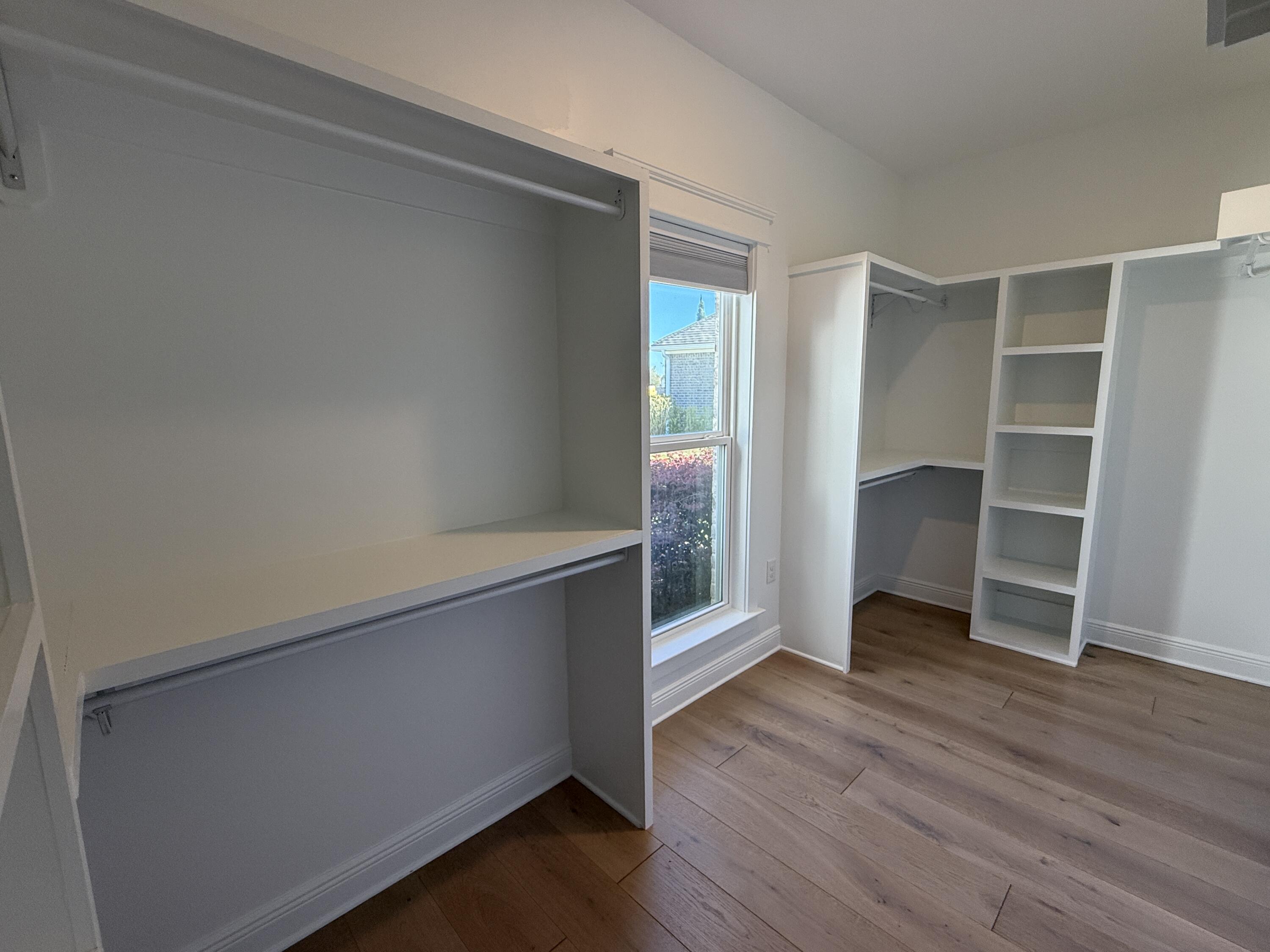 79 Mill Pond Cove Freeport, FL 32439 - Photo 18 of 63 an empty room with wooden floor and closet