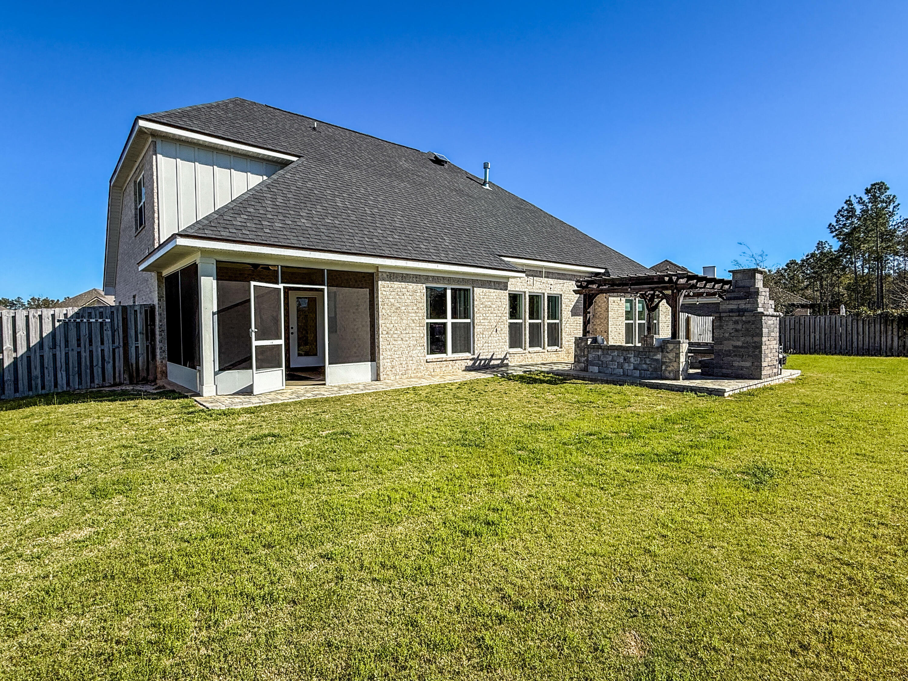 79 Mill Pond Cove Freeport, FL 32439 - Photo 21 of 63 a front view of a house with a garden