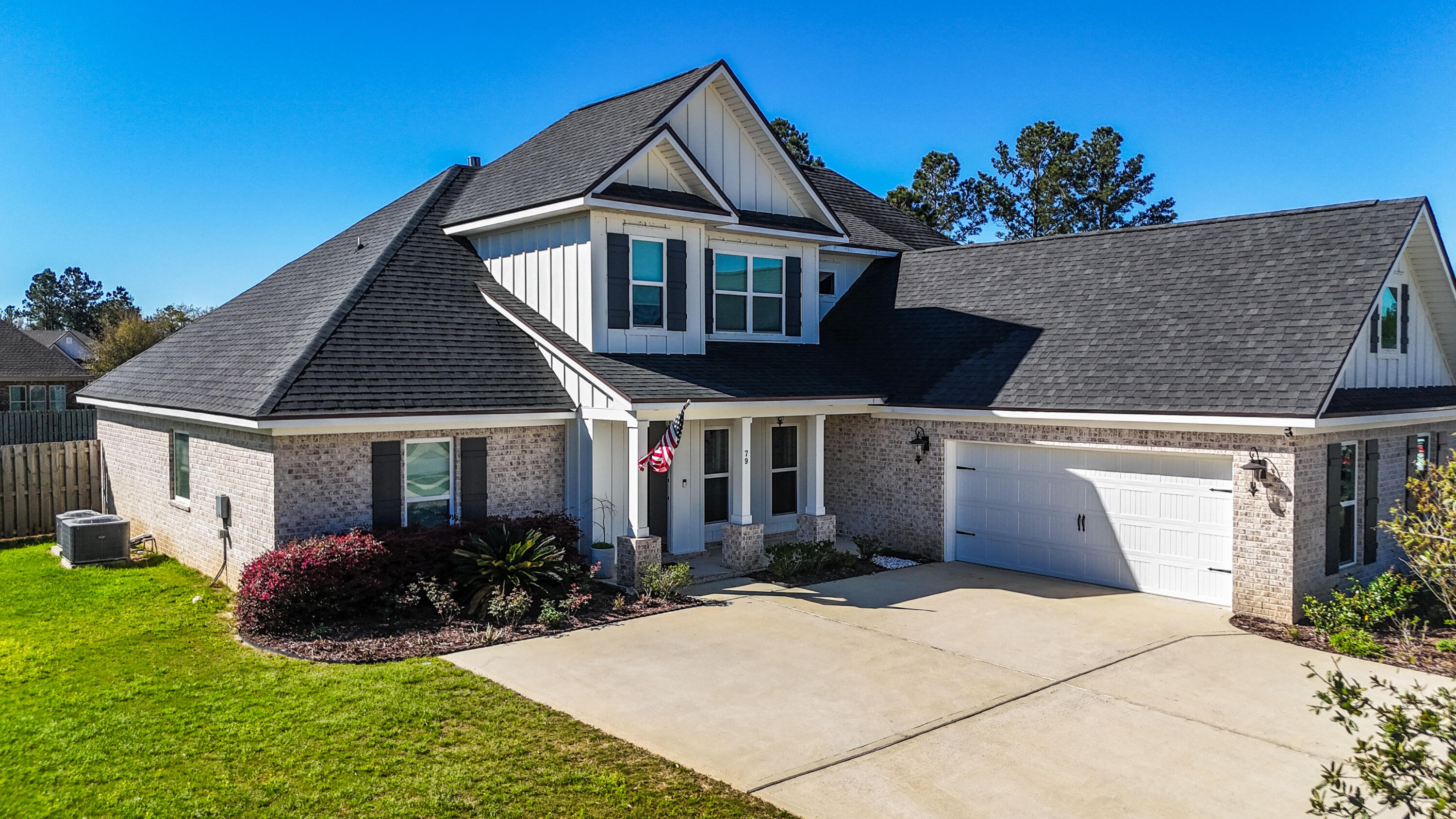 79 Mill Pond Cove Freeport, FL 32439 - Photo 25 of 63 a front view of a house with a yard