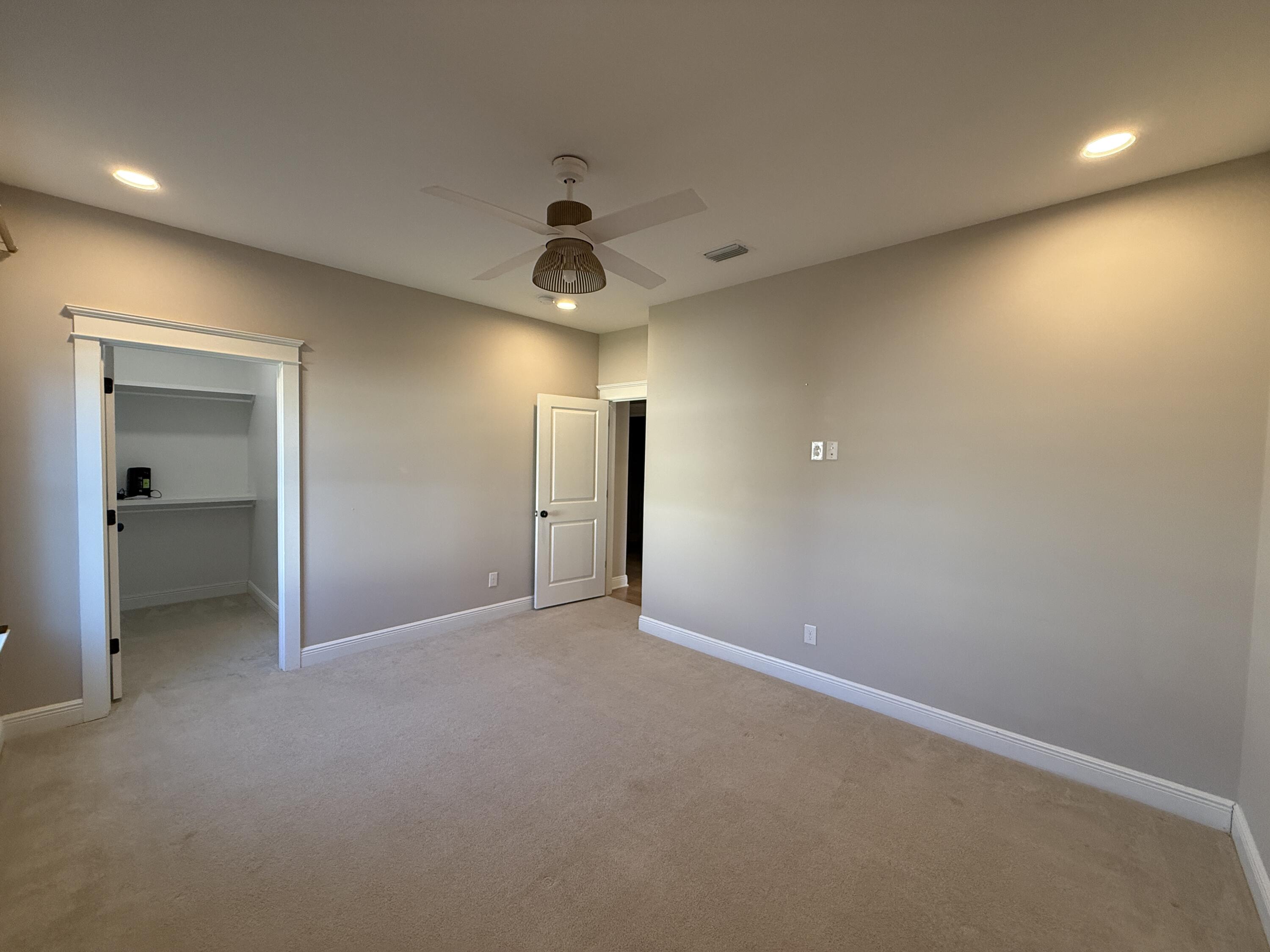 79 Mill Pond Cove Freeport, FL 32439 - Photo 28 of 63 an empty room with fan and entrance