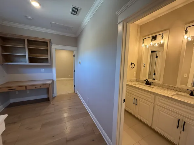 a bathroom with a mirror a sink and a shower