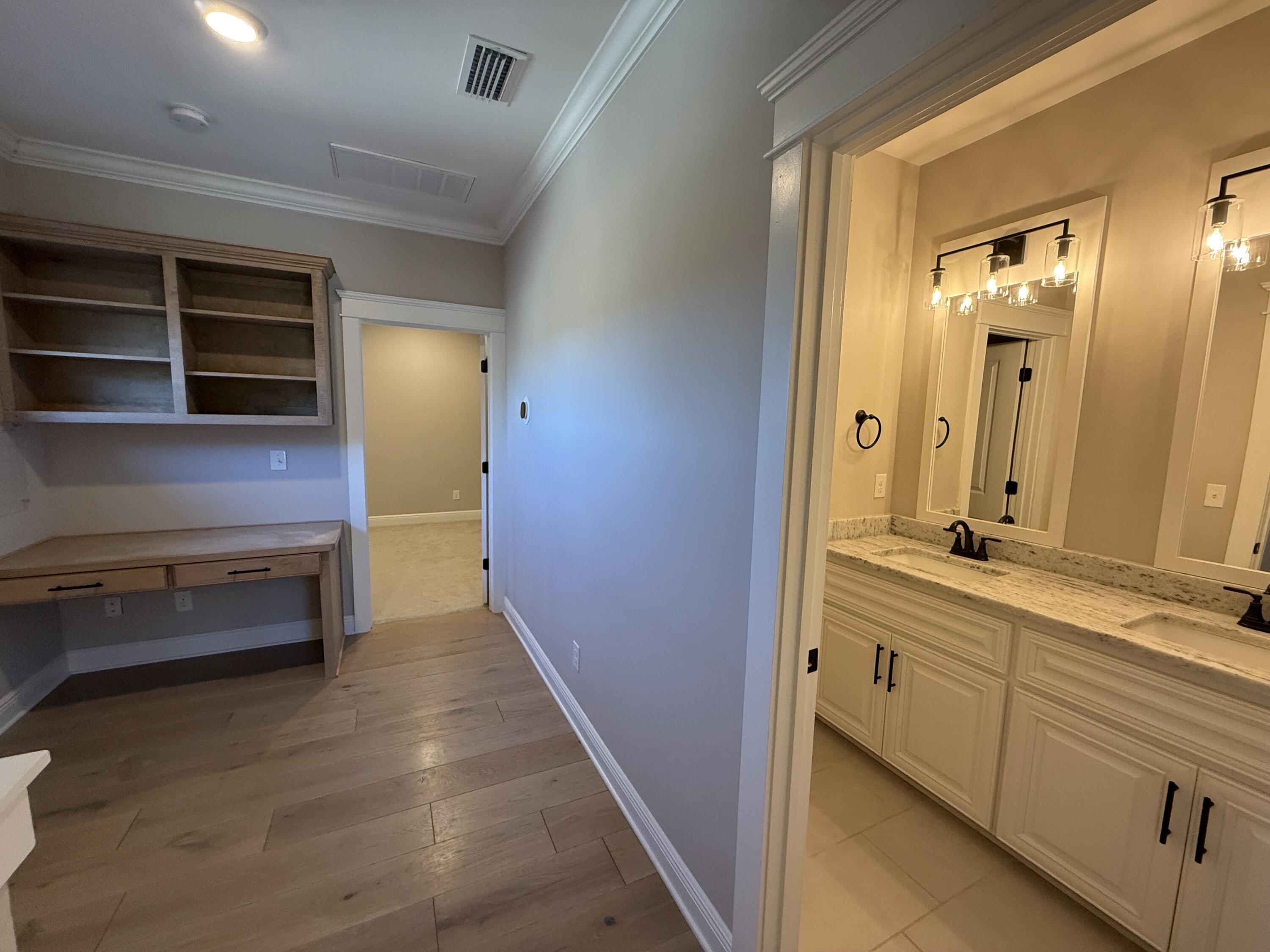 79 Mill Pond Cove Freeport, FL 32439 - Photo 32 of 63 a bathroom with a sink and a mirror