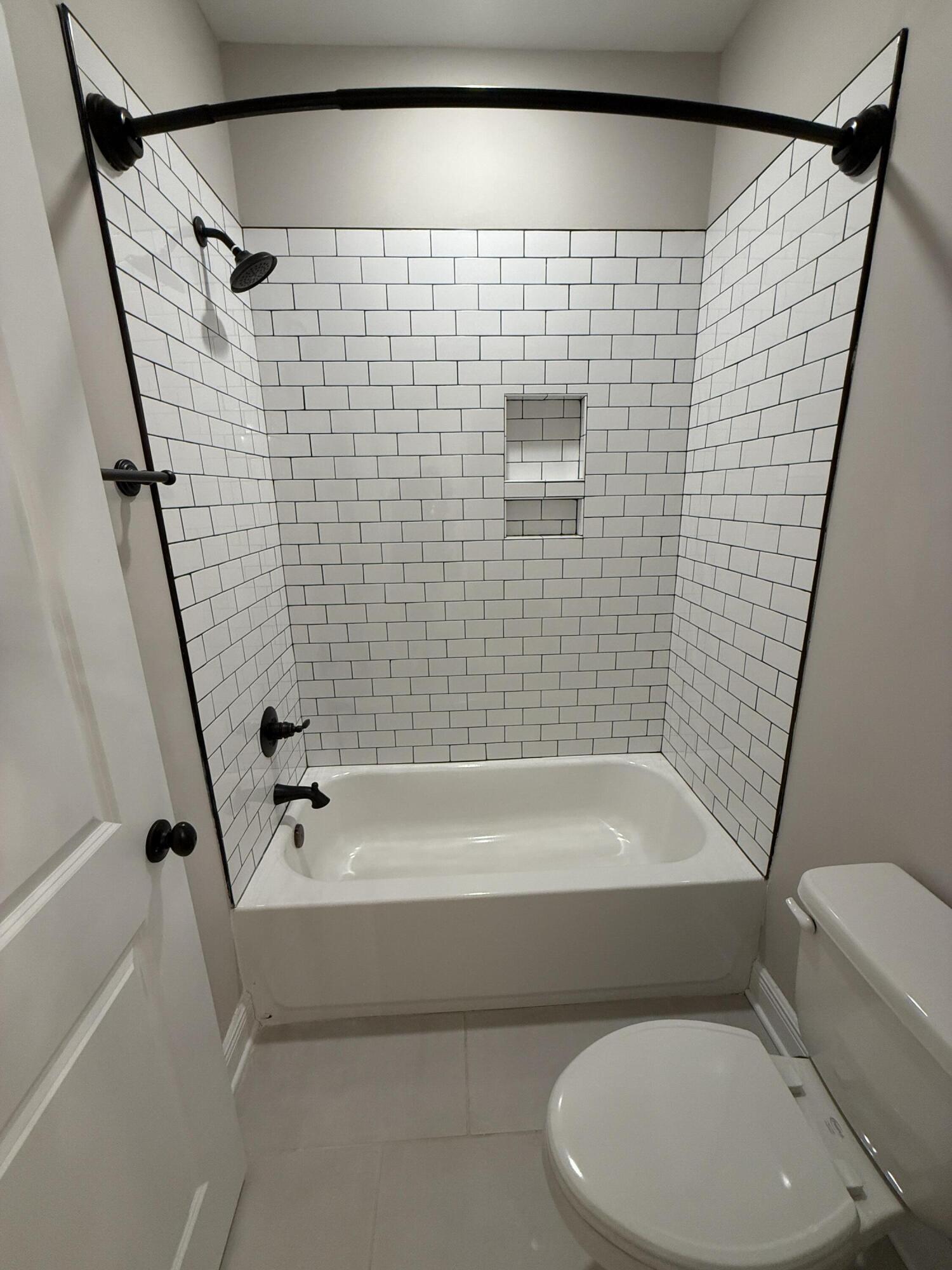 79 Mill Pond Cove Freeport, FL 32439 - Photo 37 of 63 a bathroom with a toilet and a bath tub