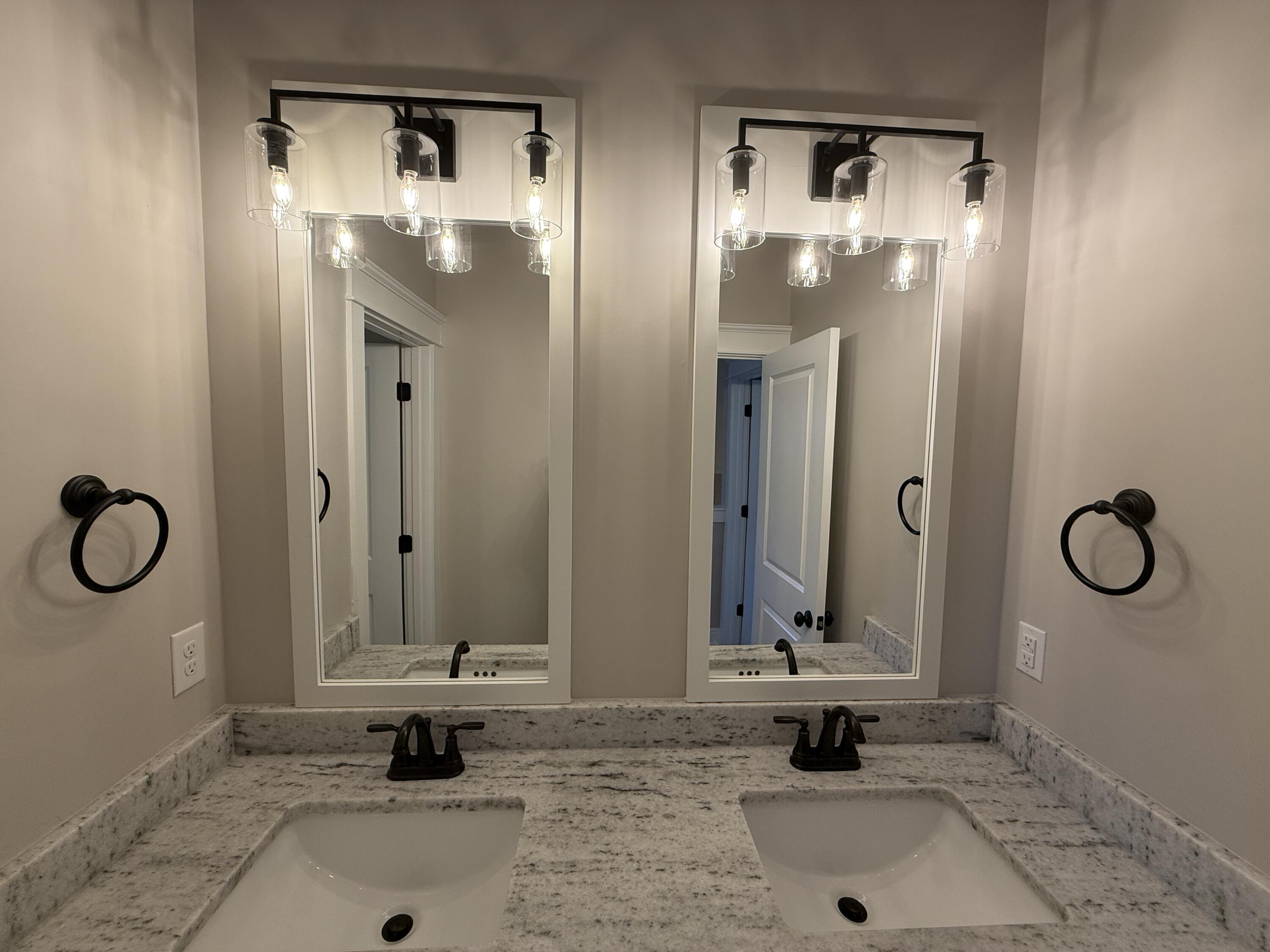 79 Mill Pond Cove Freeport, FL 32439 - Photo 38 of 63 a bathroom with a mirror a sink and a shower