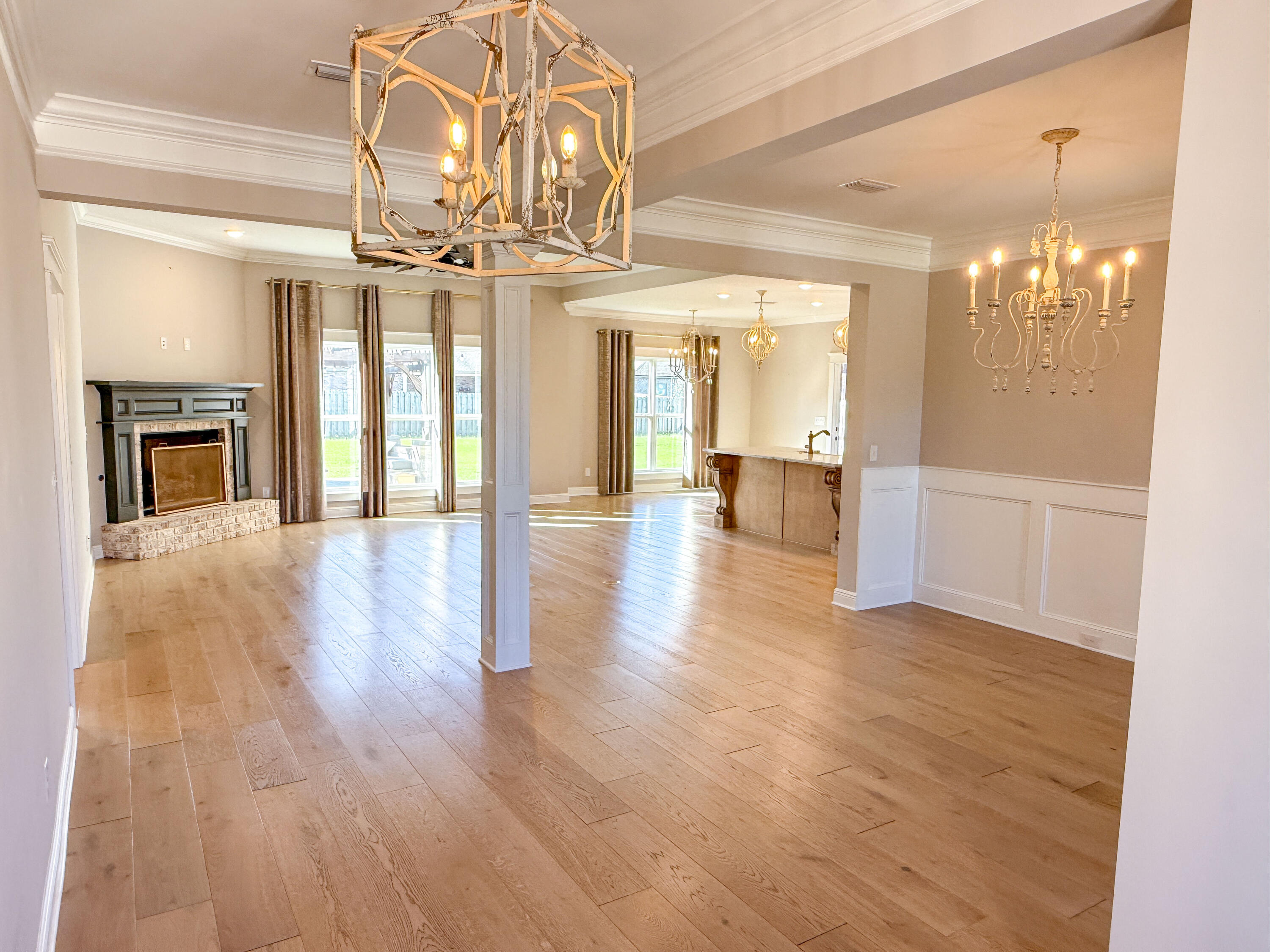 79 Mill Pond Cove Freeport, FL 32439 - Photo 4 of 63 a view of a room with wooden floor and chandelier