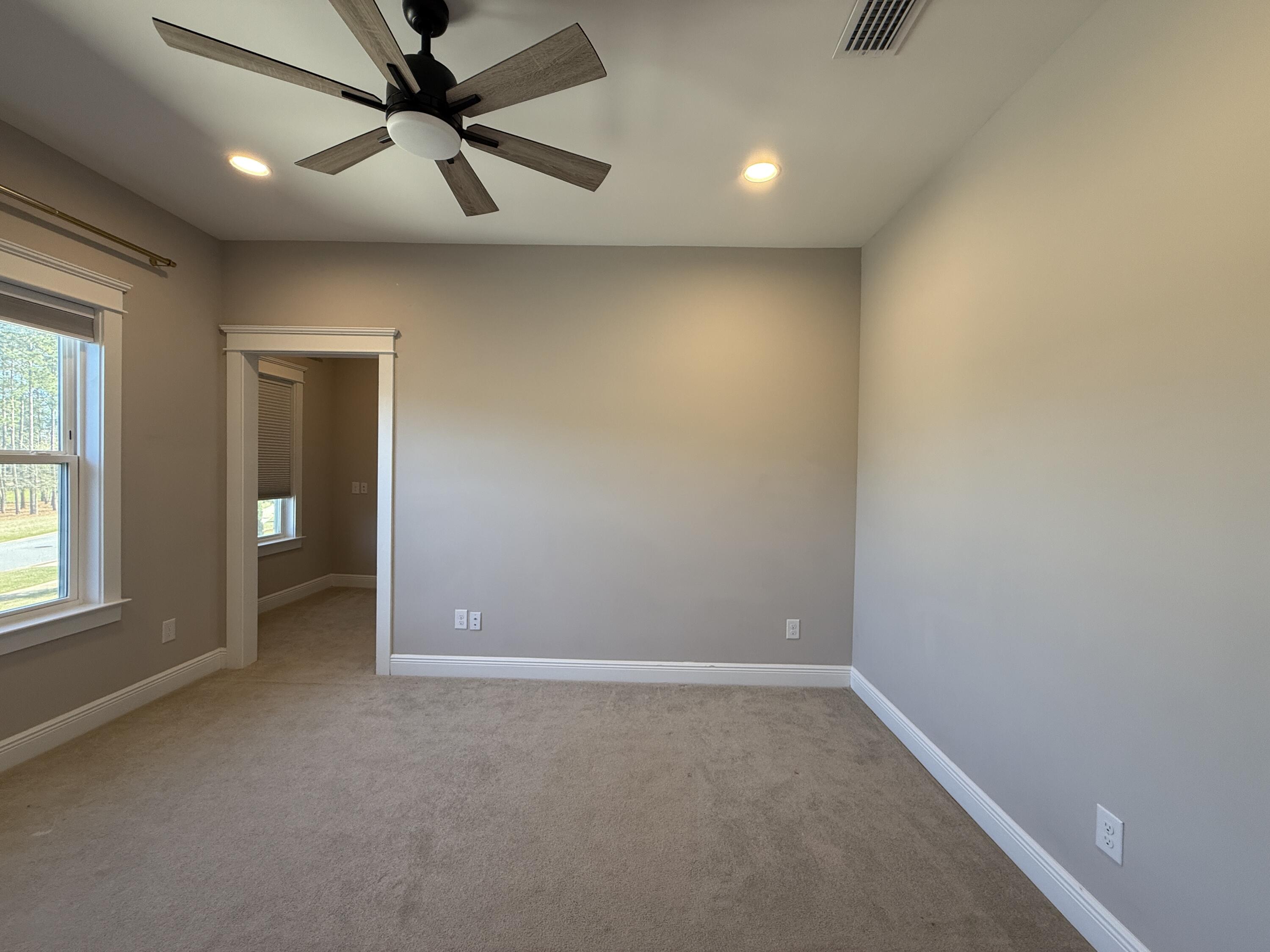 79 Mill Pond Cove Freeport, FL 32439 - Photo 41 of 63 an empty room with a ceiling fan and window