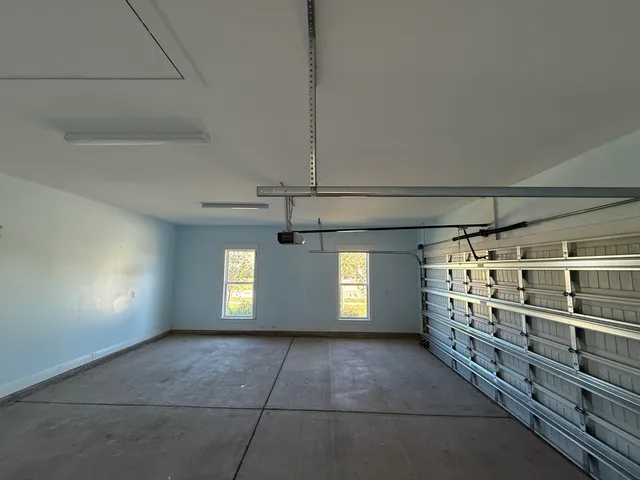 a large kitchen with stainless steel appliances granite countertop a lot of counter space and wooden floor
