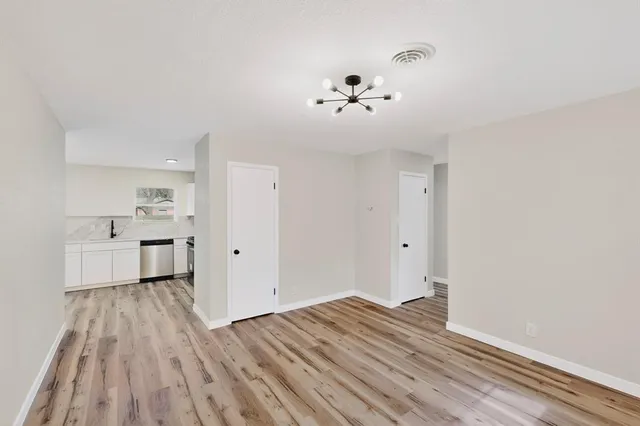 a view of a livingroom with wooden floor
