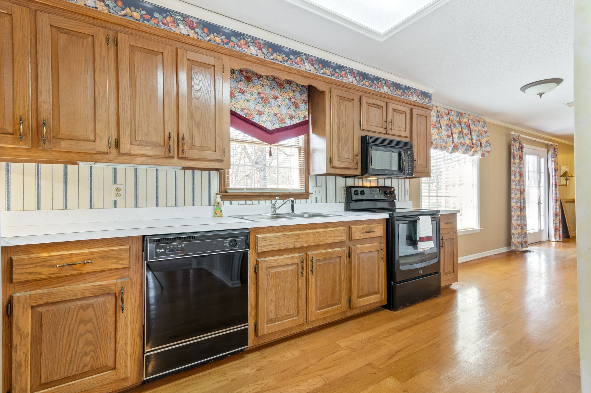 846 R Wilkerson Drive Centerville, TN 37033 - Photo 38 of 68 a kitchen with stainless steel appliances granite countertop a stove a sink and a microwave
