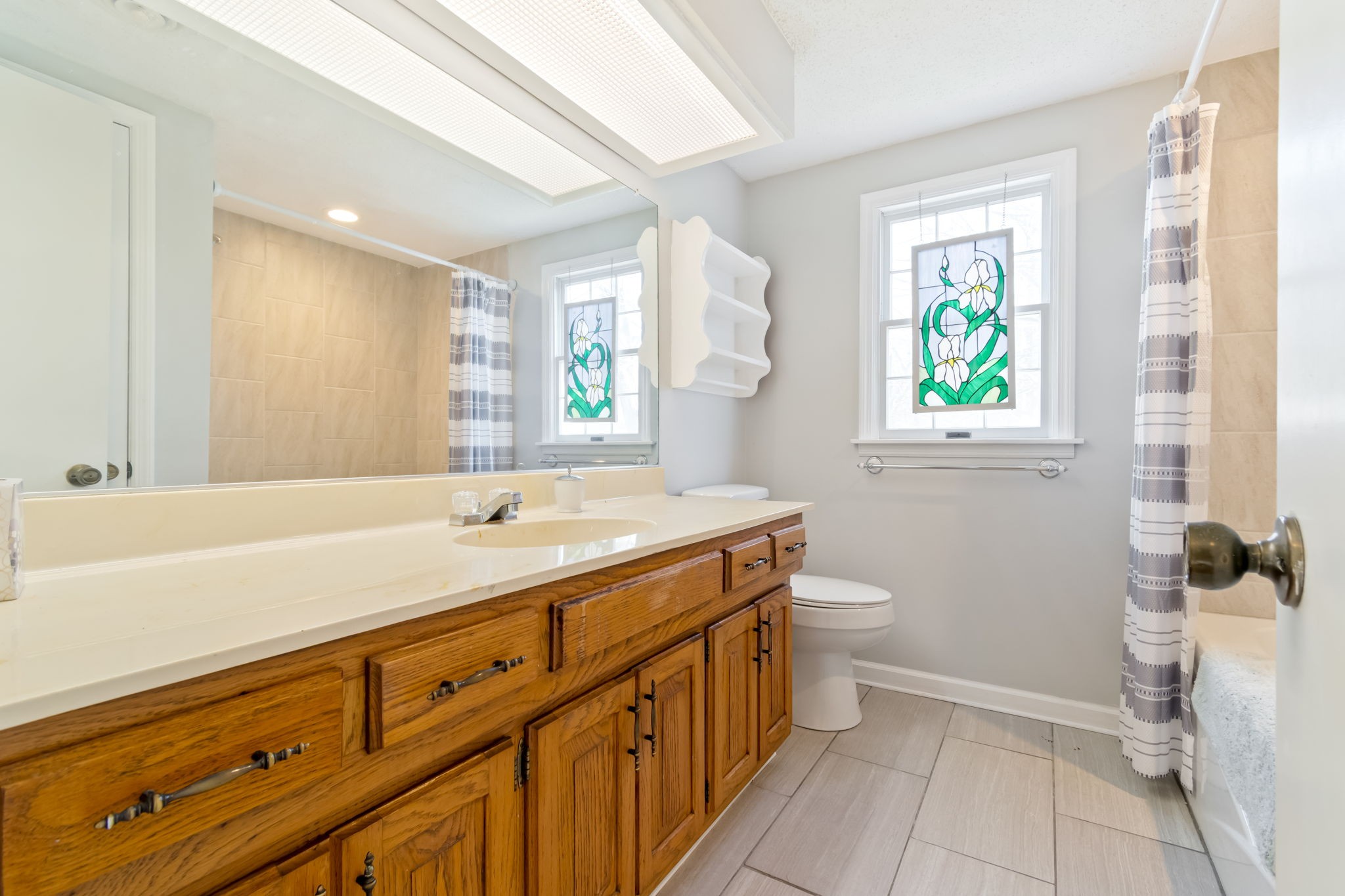 846 R Wilkerson Drive Centerville, TN 37033 - Photo 45 of 68 a bathroom with a double vanity sink toilet and a tub
