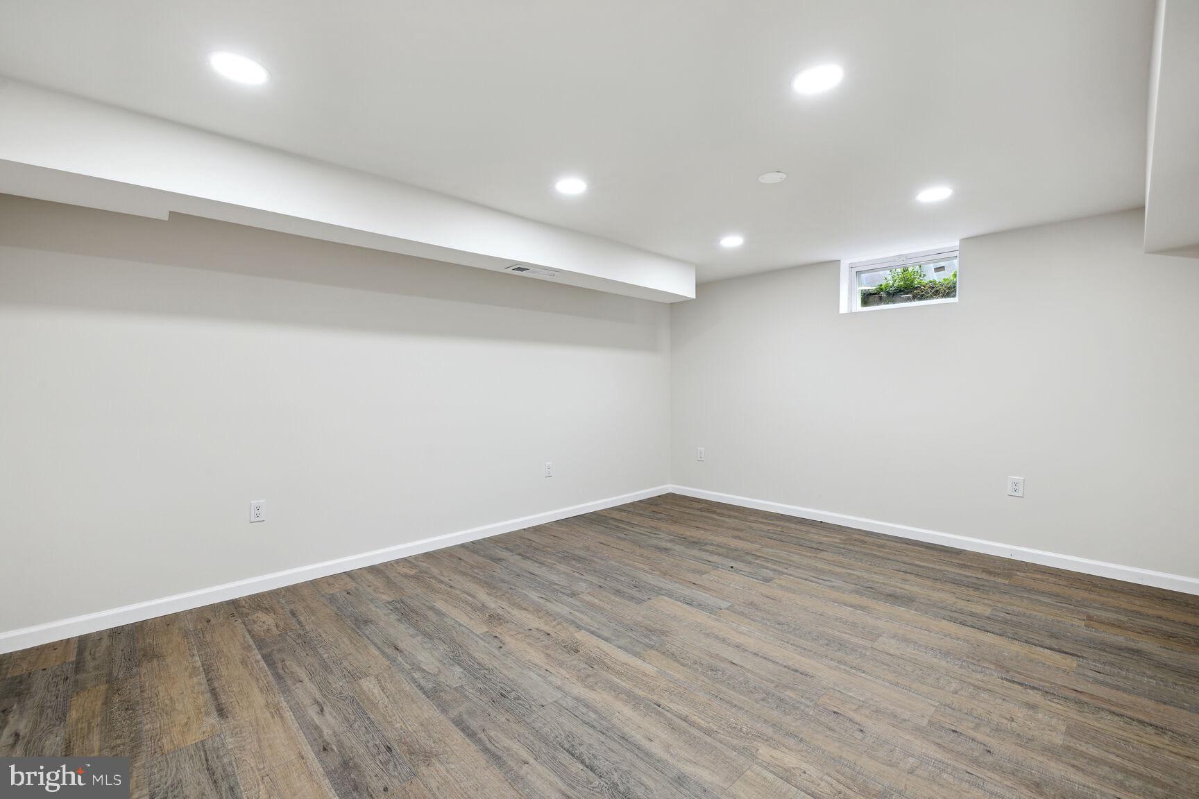 606 Biggs Avenue Frederick, MD 21702 - Photo 15 of 20 a view of an empty room with wooden floor