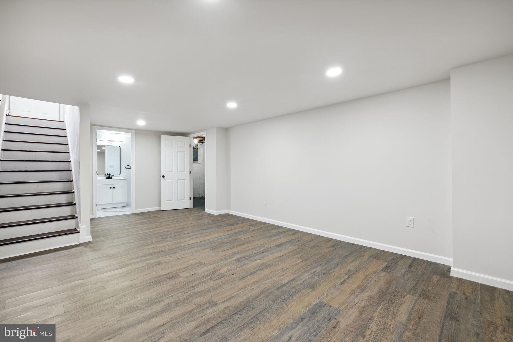 606 Biggs Avenue Frederick, MD 21702 - Photo 17 of 20 a view of an empty room with wooden floor and closet