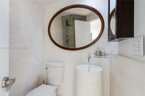 a bathroom with a toilet and a sink
