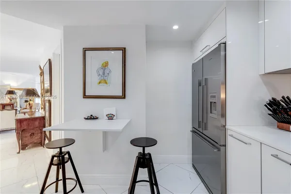 a kitchen with stainless steel appliances a refrigerator and a sink