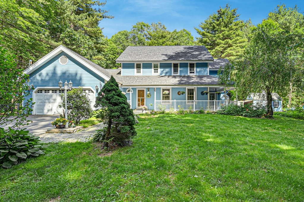 210 New Boston Road Sturbridge, MA 01566 - Photo 1 of 42 a front view of a house with a yard