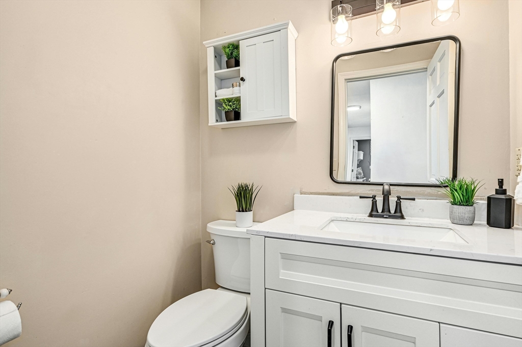 210 New Boston Road Sturbridge, MA 01566 - Photo 19 of 42 a bathroom with a toilet sink and mirror