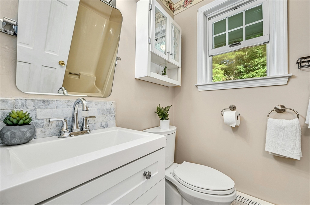 210 New Boston Road Sturbridge, MA 01566 - Photo 23 of 42 a bathroom with a sink a toilet and mirror