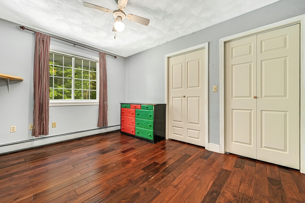 210 New Boston Road Sturbridge, MA 01566 - Photo 24 of 42 a view of an empty room with wooden floor and a window