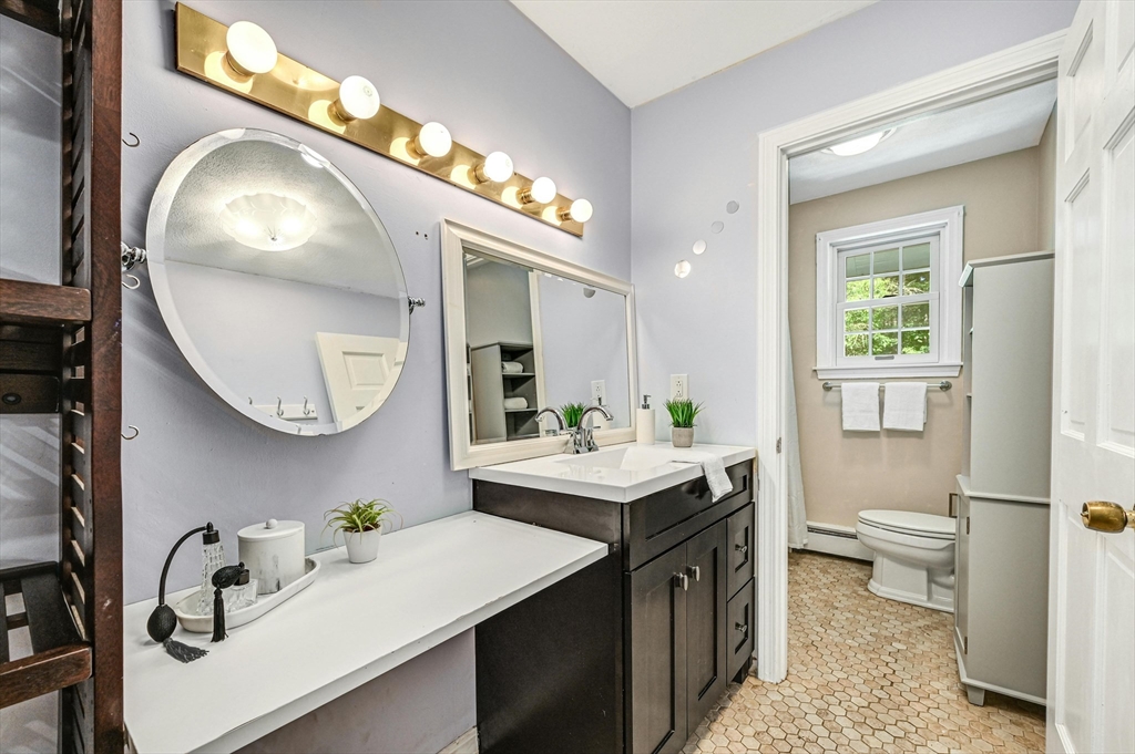210 New Boston Road Sturbridge, MA 01566 - Photo 27 of 42 a bathroom with a sink a toilet and a mirror