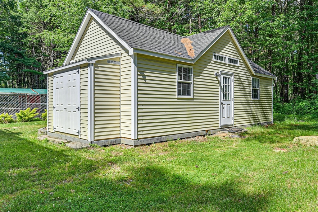 210 New Boston Road Sturbridge, MA 01566 - Photo 29 of 42 a view of a house with a yard