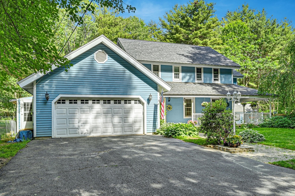 210 New Boston Road Sturbridge, MA 01566 - Photo 3 of 42 a front view of a house with a garden