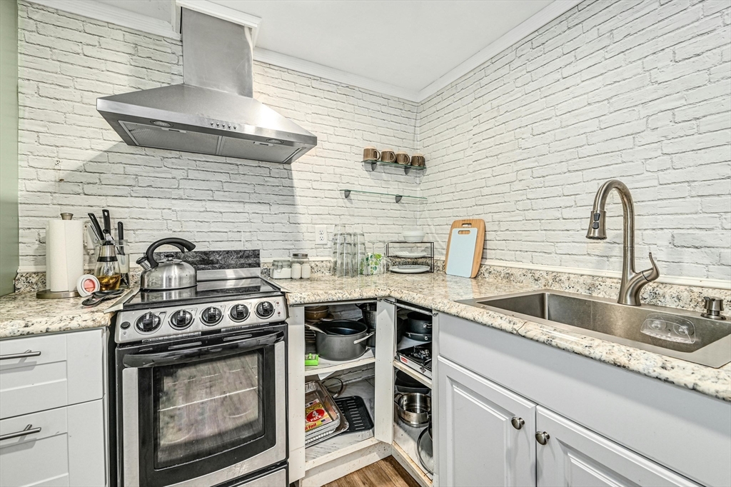 210 New Boston Road Sturbridge, MA 01566 - Photo 31 of 42 a kitchen with a stove and a sink