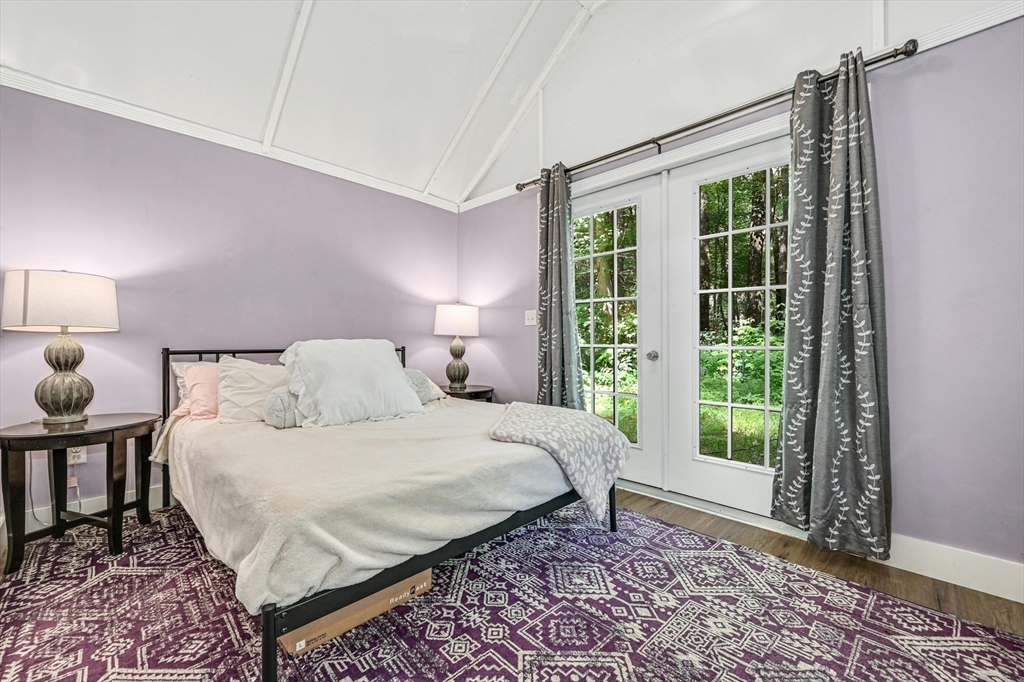 210 New Boston Road Sturbridge, MA 01566 - Photo 33 of 42 a bedroom with a bed lamps and window